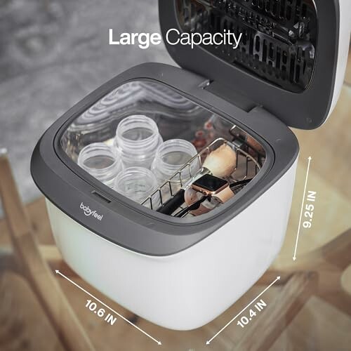 Top view of a sterilizer with jars and a watch inside.