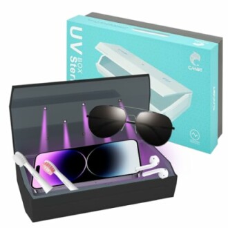 UV sterilizer box sanitizing smartphone, sunglasses, toothbrush, and earbuds.