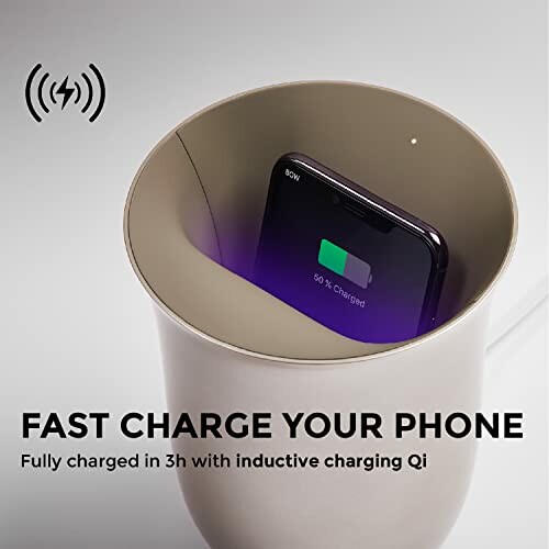 Phone charging in a wireless charging cup holder with text 'Fast charge your phone'.