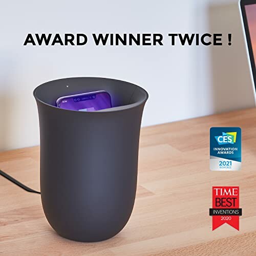 Wireless phone charger with awards on display.